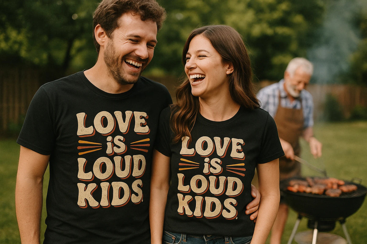 Person wearing the black family life t shirt graphic tee - "Love Is Loud Kids" design