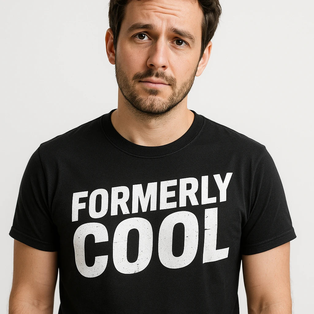 Close-up of the "Formerly Cool" white print on a premium Bella+Canvas black parent identity crisis shirts