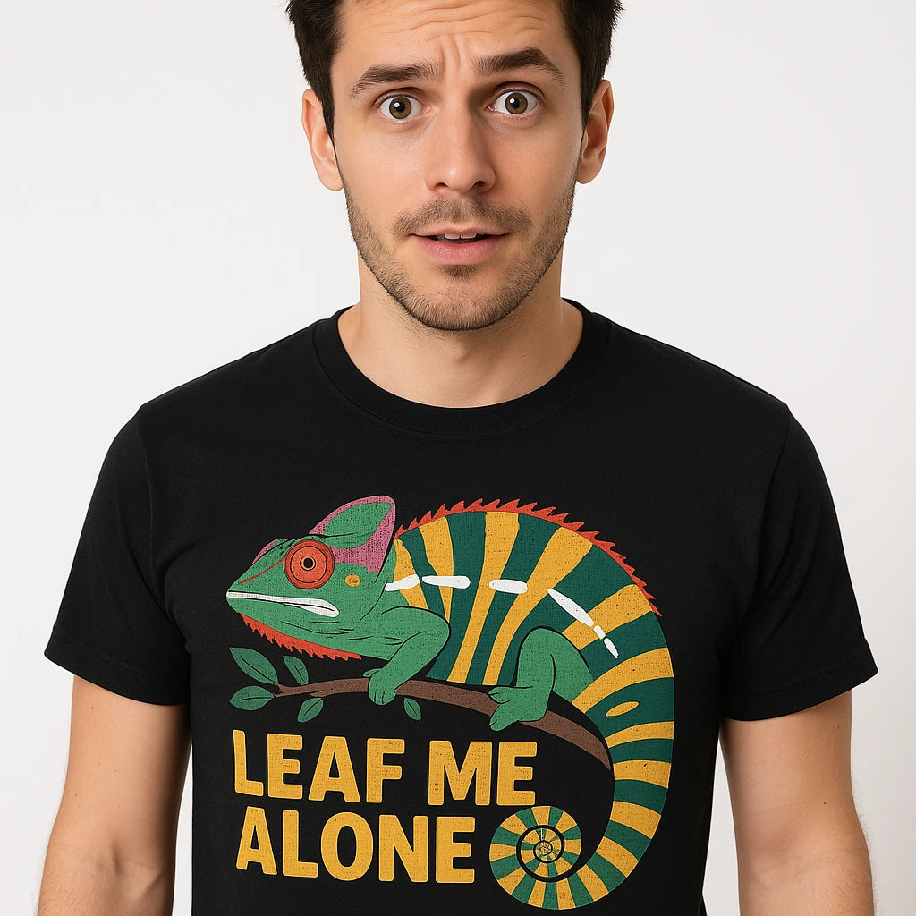 Close-up of the "Leaf Me Alone" green print on a premium Bella+Canvas black chameleon shirts