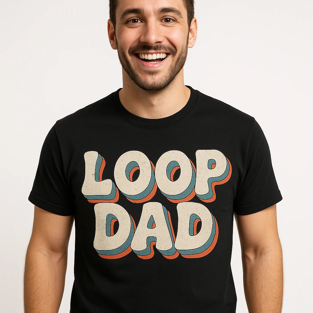 Close-up of the "Loop Dad" beige print on a premium Bella+Canvas black producer t shirt