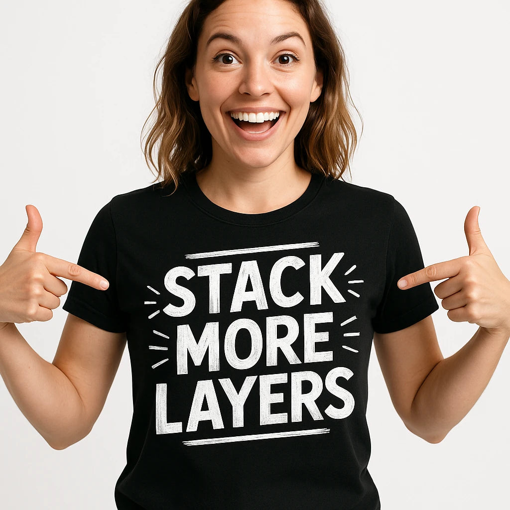 Close-up of the "Stack More Layers" white print on a premium Bella+Canvas black artificial intelligence t shirt