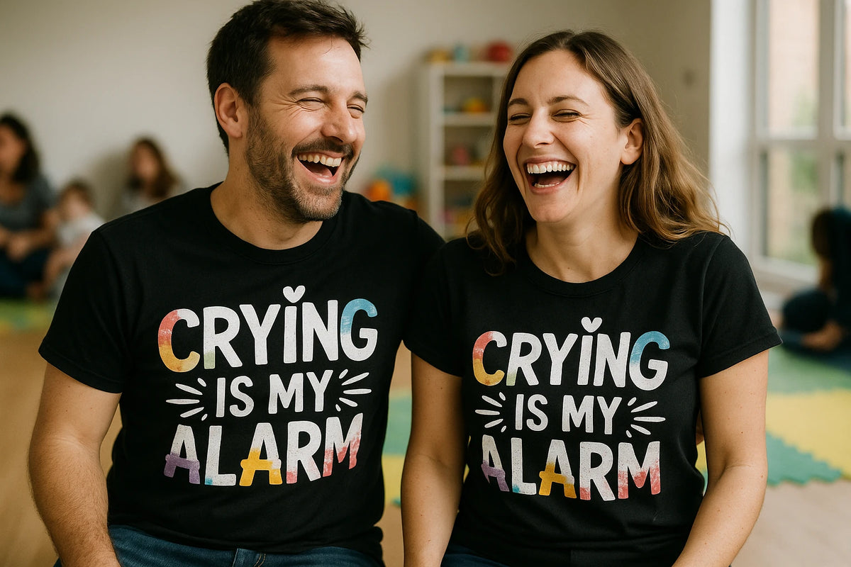 Person wearing the black new parents shirts graphic tee - "Crying Is My Alarm" design