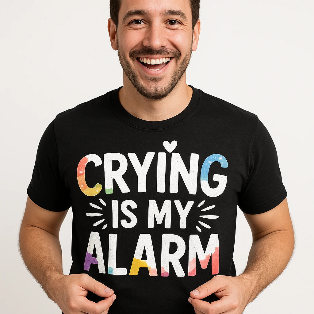 Close-up of the "Crying Is My Alarm" white print on a premium Bella+Canvas black new parents shirts