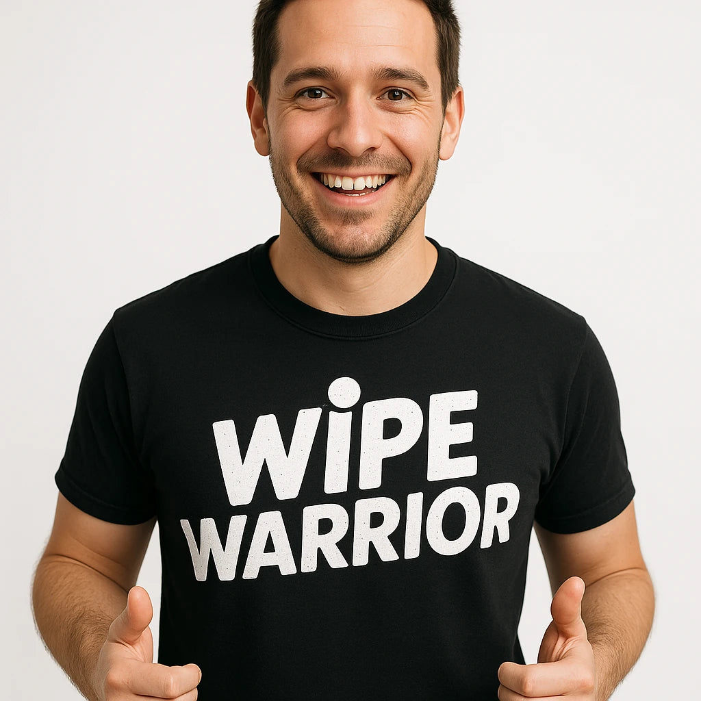 Close-up of the "Wipe Warrior" white print on a premium Bella+Canvas black diaper duty t shirt