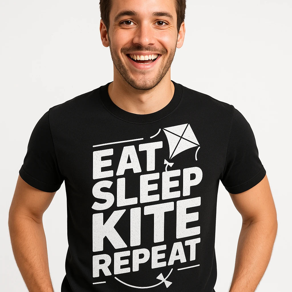 Close-up of the "Eat Sleep Kite Repeat" white print on a premium Bella+Canvas black kite flying t shirt