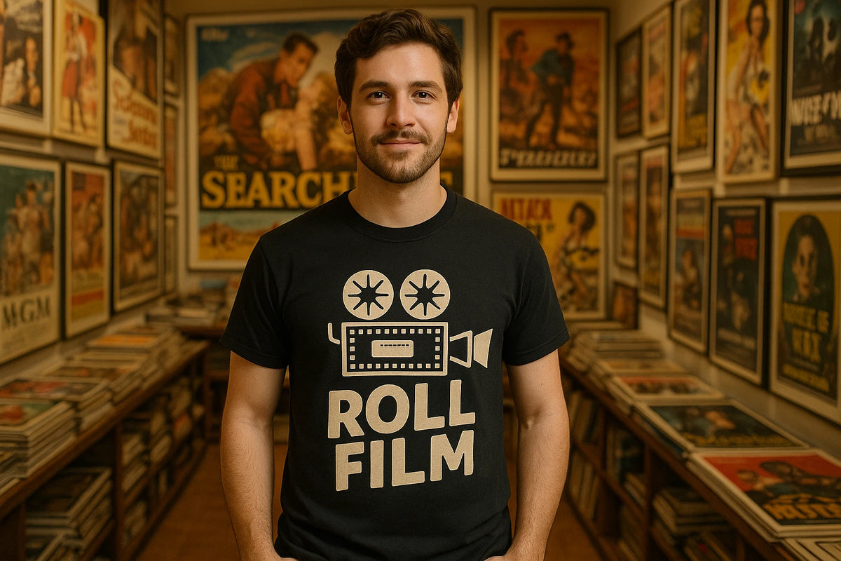 Lifestyle shot of the "Roll Film" black graphic tee in a real-world setting