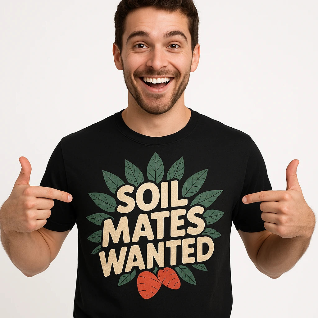 Close-up of the "Soil Mates Wanted" beige print on a premium Bella+Canvas black botany t shirt