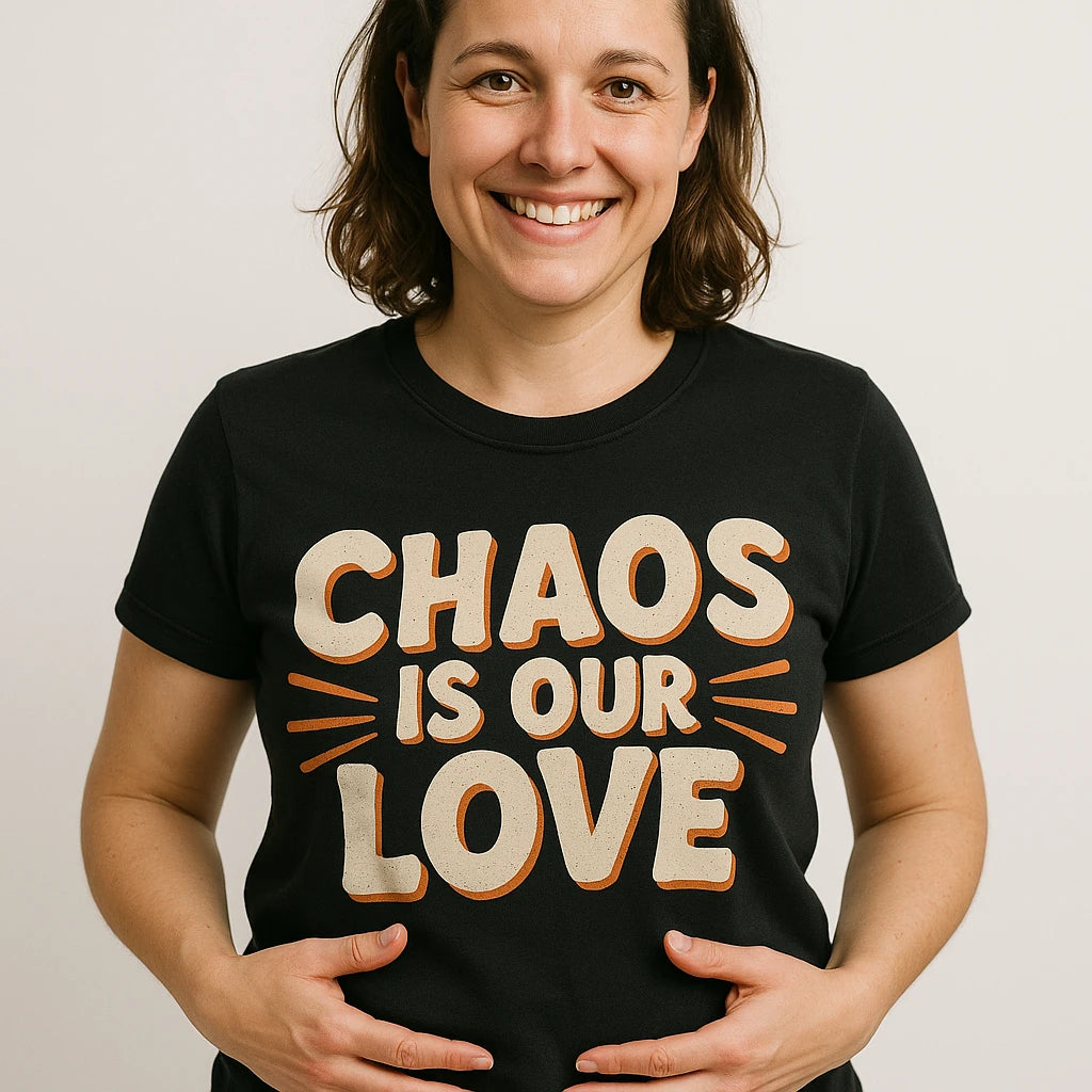Close-up of the "Chaos Is Our Love" beige print on a premium Bella+Canvas black family life t shirt