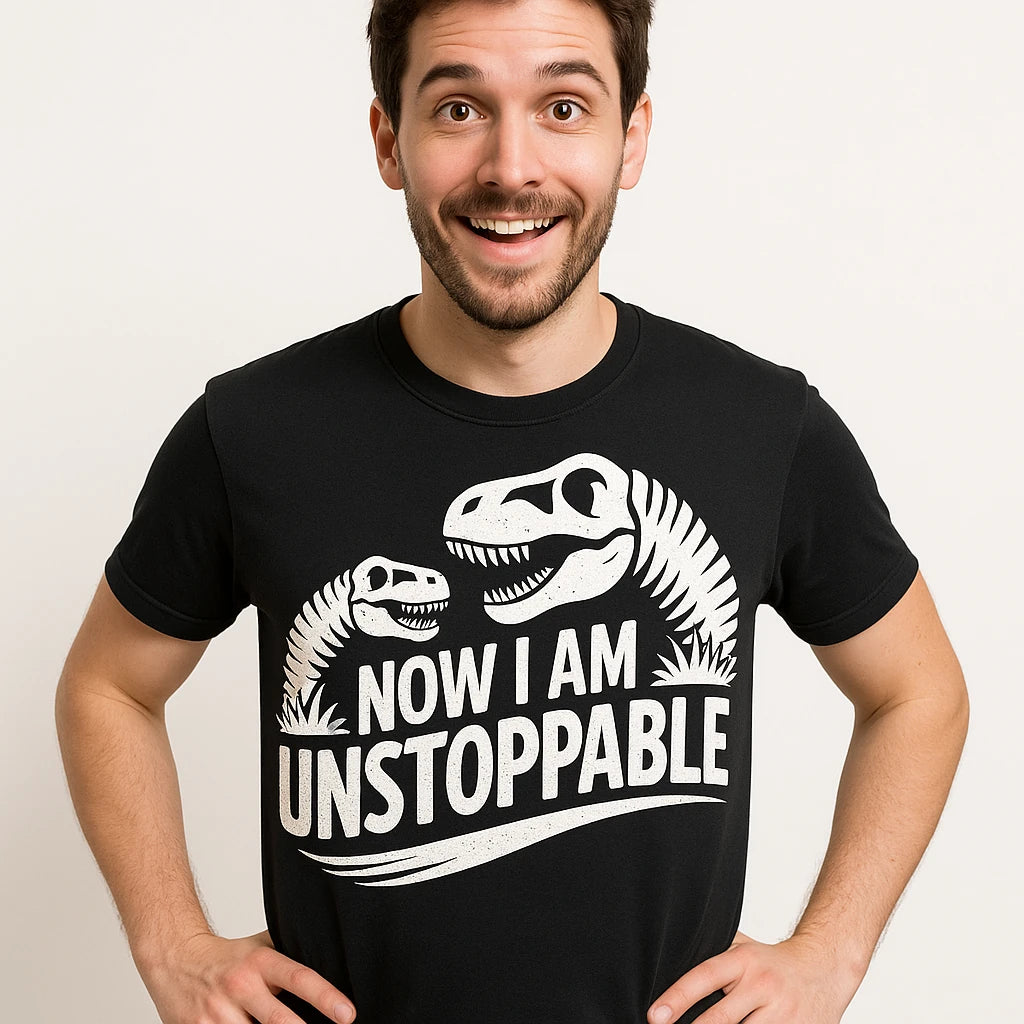 Close-up of the "Now I Am Unstoppable" white print on a premium Bella+Canvas black paleontology shirts