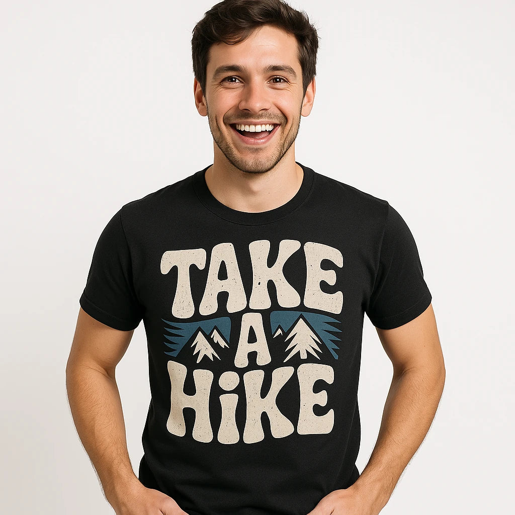 Close-up of the "Take a Hike" beige print on a premium Bella+Canvas black shirts for trekking