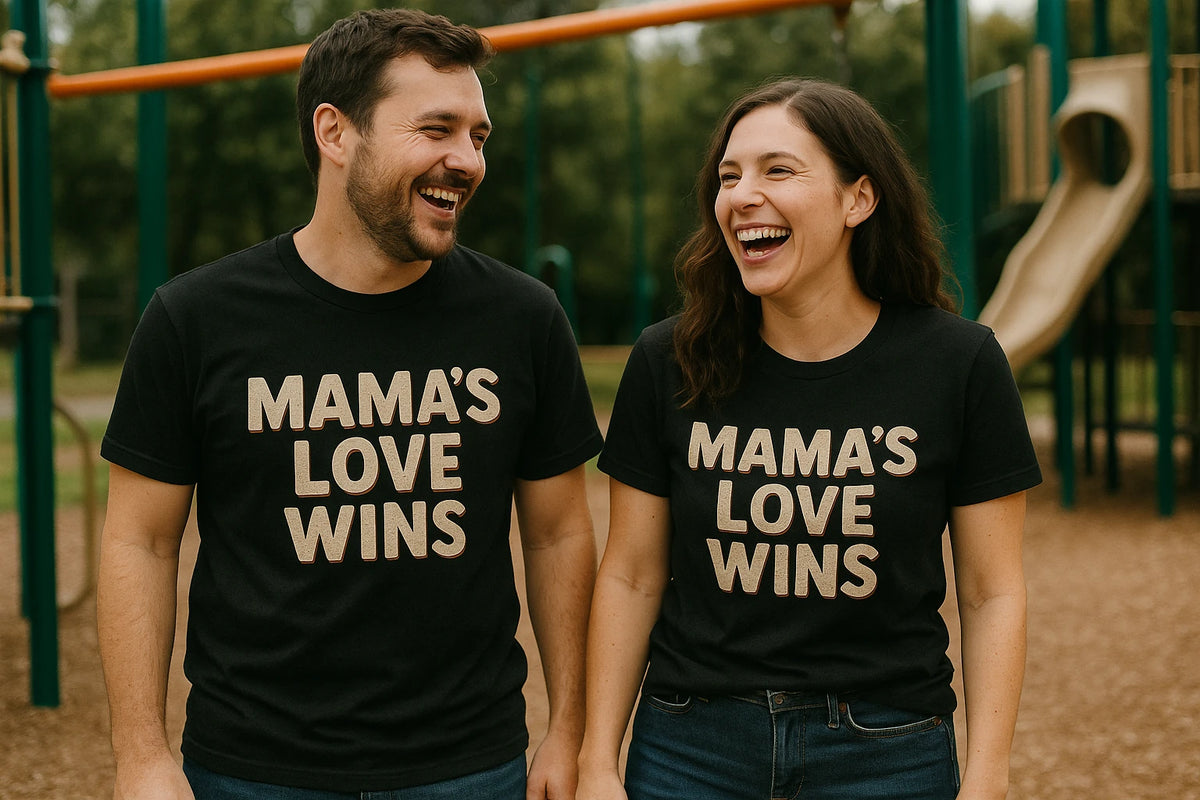 Person wearing the black t shirt mom life graphic tee - "Mama'S Love Wins" design