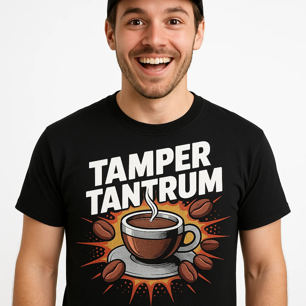 Close-up of the "Tamper Tantrum" gray print on a premium Bella+Canvas black espresso shirts
