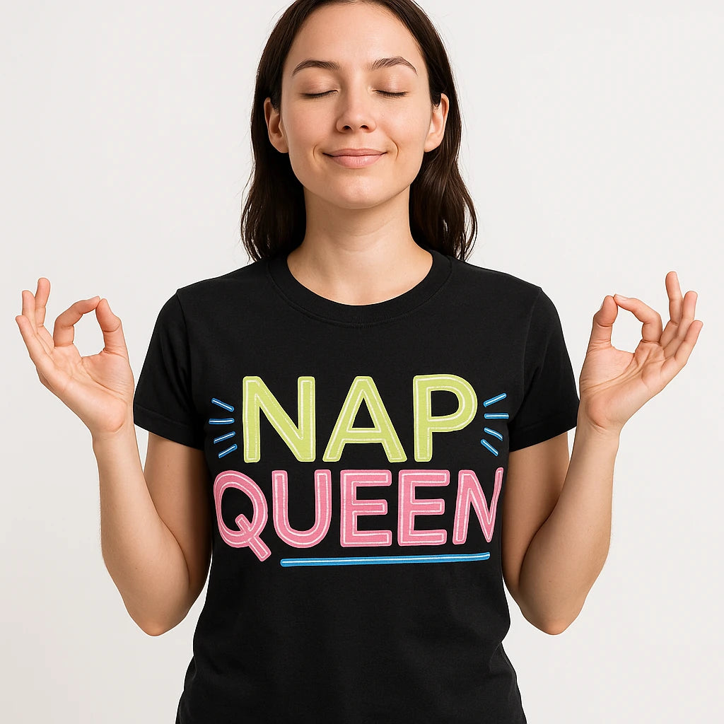 Close-up of the "Nap Queen" tan print on a premium Bella+Canvas black relaxing t shirt