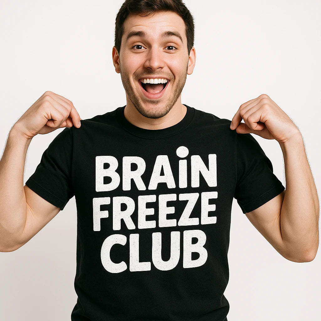 Close-up of the "Brain Freeze Club" white print on a premium Bella+Canvas black cream t shirt