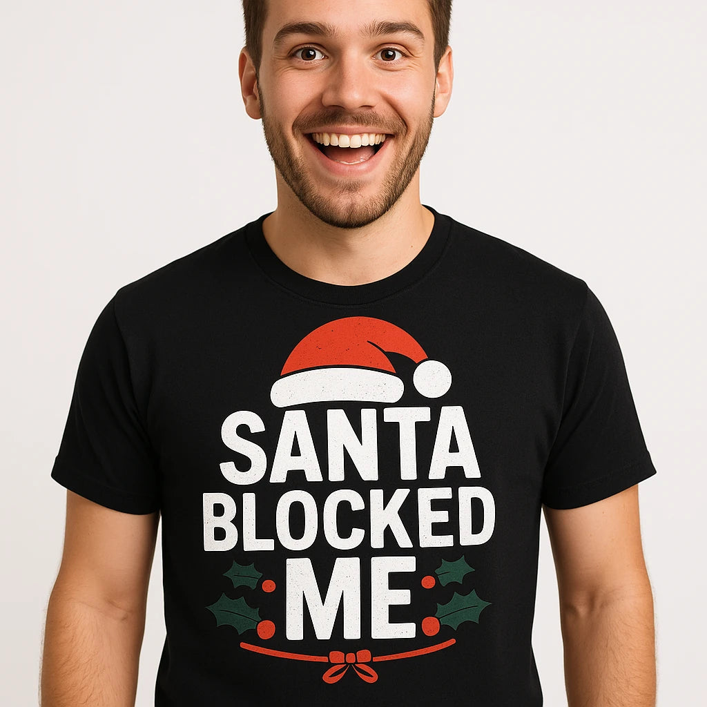Close-up of the "Santa Blocked Me" white print on a premium Bella+Canvas black christmas t shirt