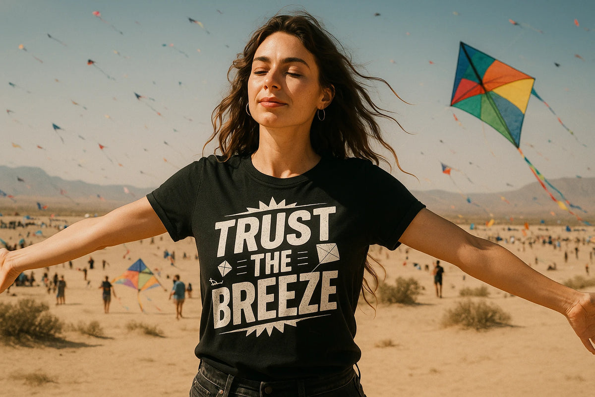 Lifestyle shot of the "Trust the Breeze" black kite flying t shirt in a real-world setting