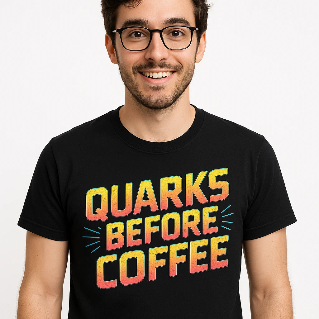 Close-up of the "Quarks Before Coffee" orange print on a premium Bella+Canvas black physics t shirt