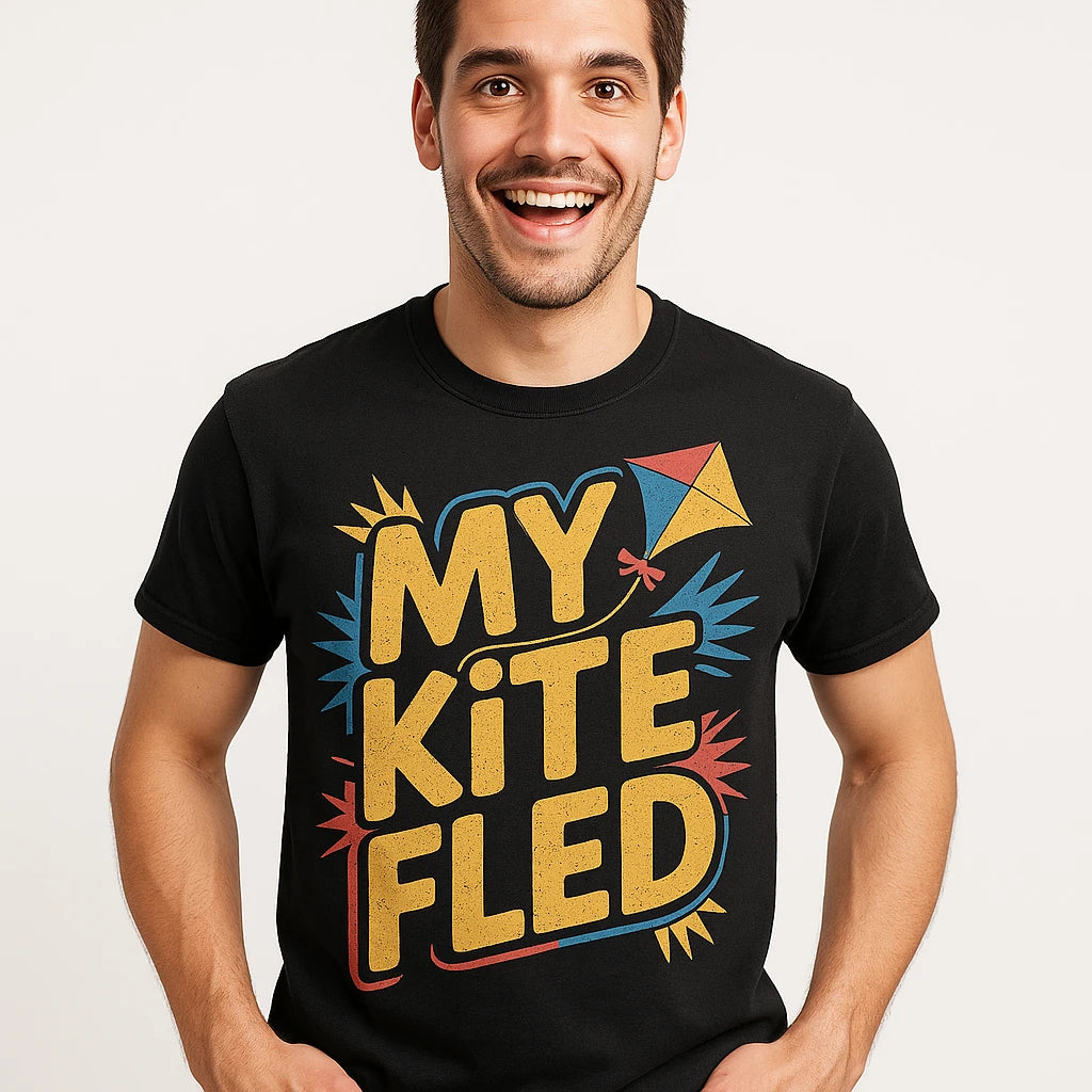 Close-up of the "My Kite Fled" gold print on a premium Bella+Canvas black kite flying shirts