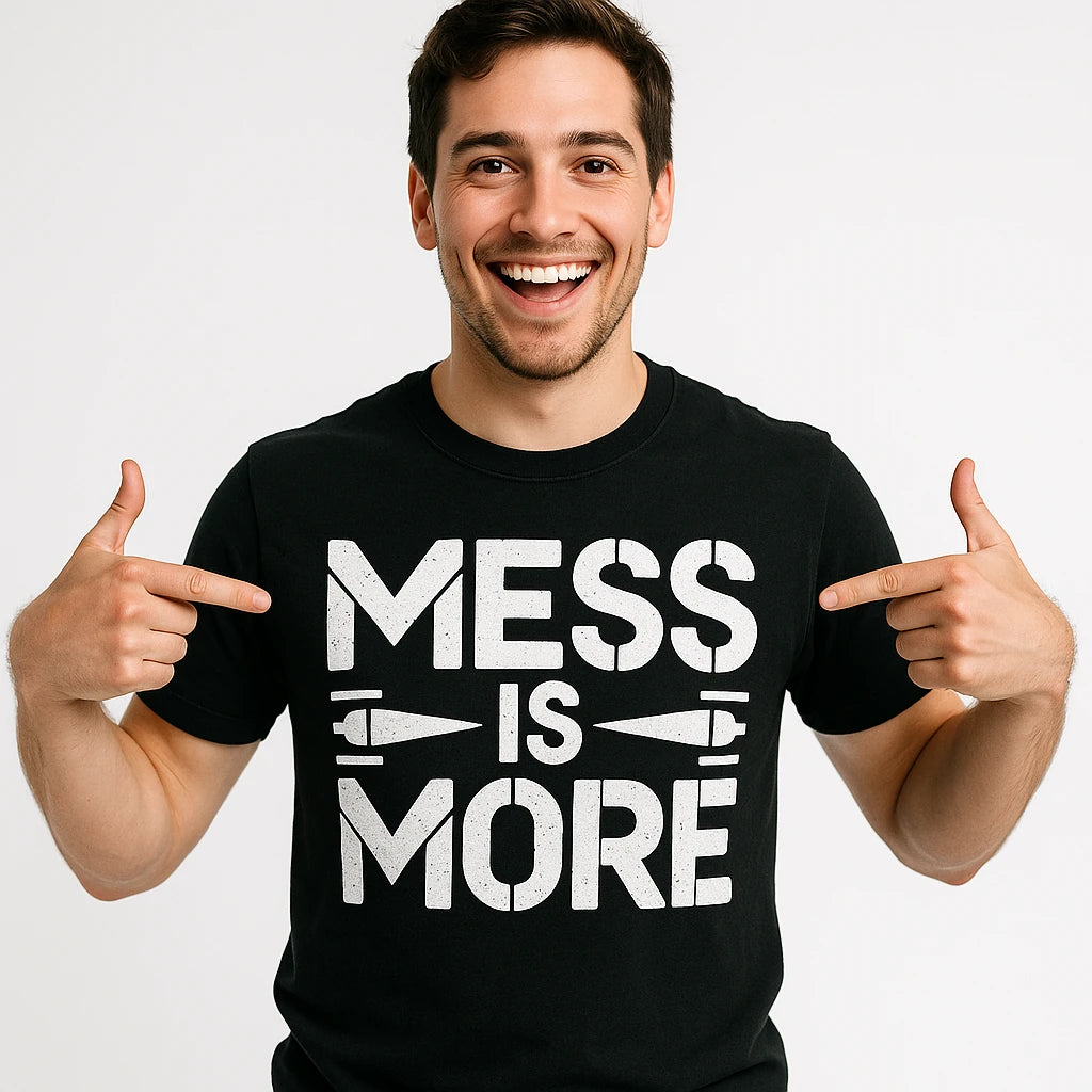 Close-up of the "Mess Is More" white print on a premium Bella+Canvas black minimalist geometric sculpting t shirt