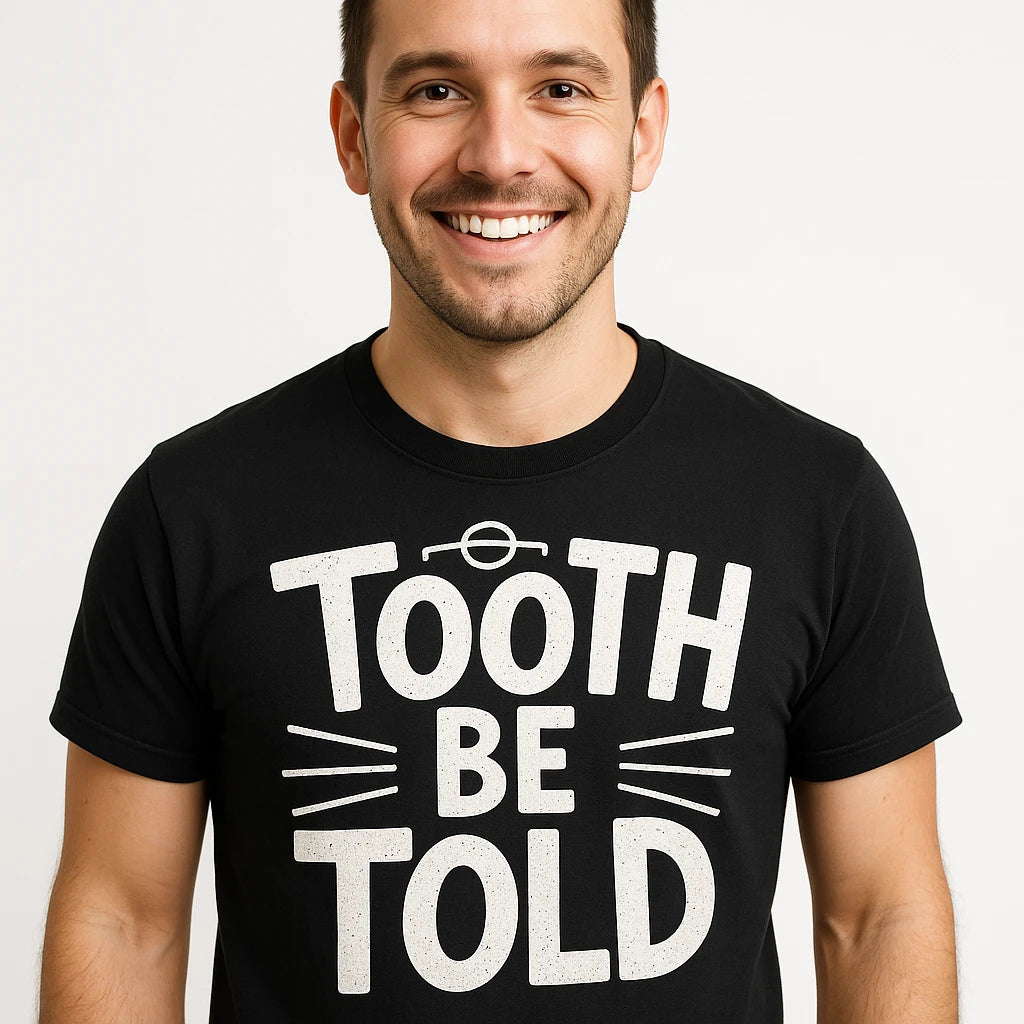 Close-up of the "Tooth Be Told" white print on a premium Bella+Canvas black dentist t shirt
