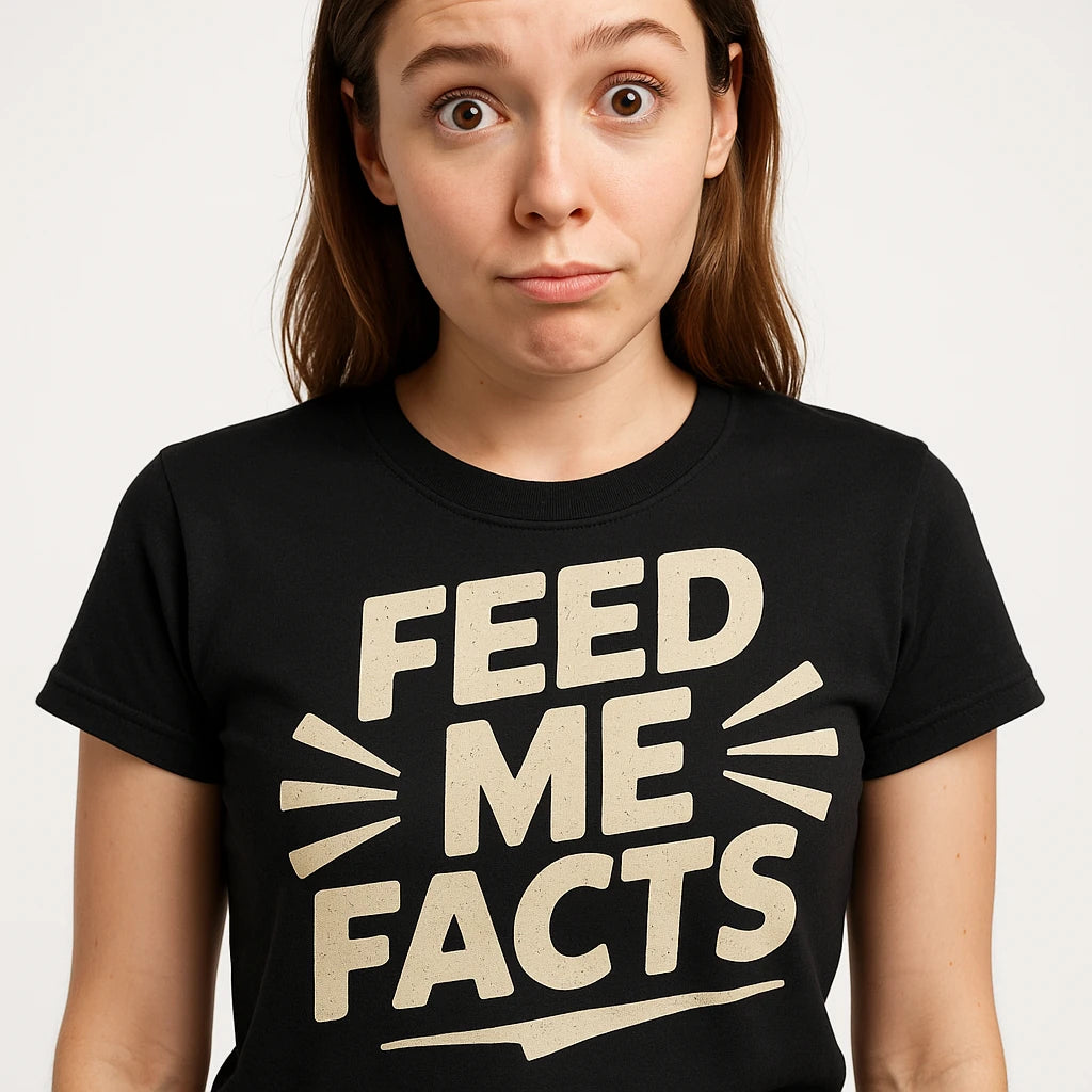 Close-up of the "Feed Me Facts" beige print on a premium Bella+Canvas black studying t shirt