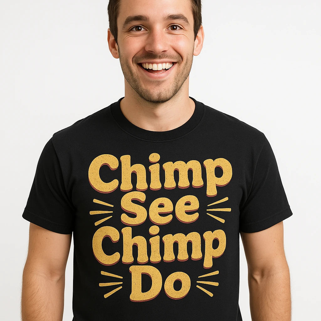 Close-up of the "Chimp See Chimp Do" tan print on a premium Bella+Canvas black chimpanzee t shirt