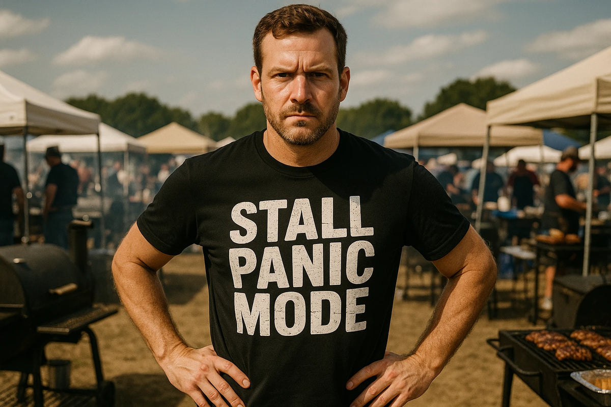 Lifestyle shot of the "Stall Panic Mode" black bbq tee in a real-world setting