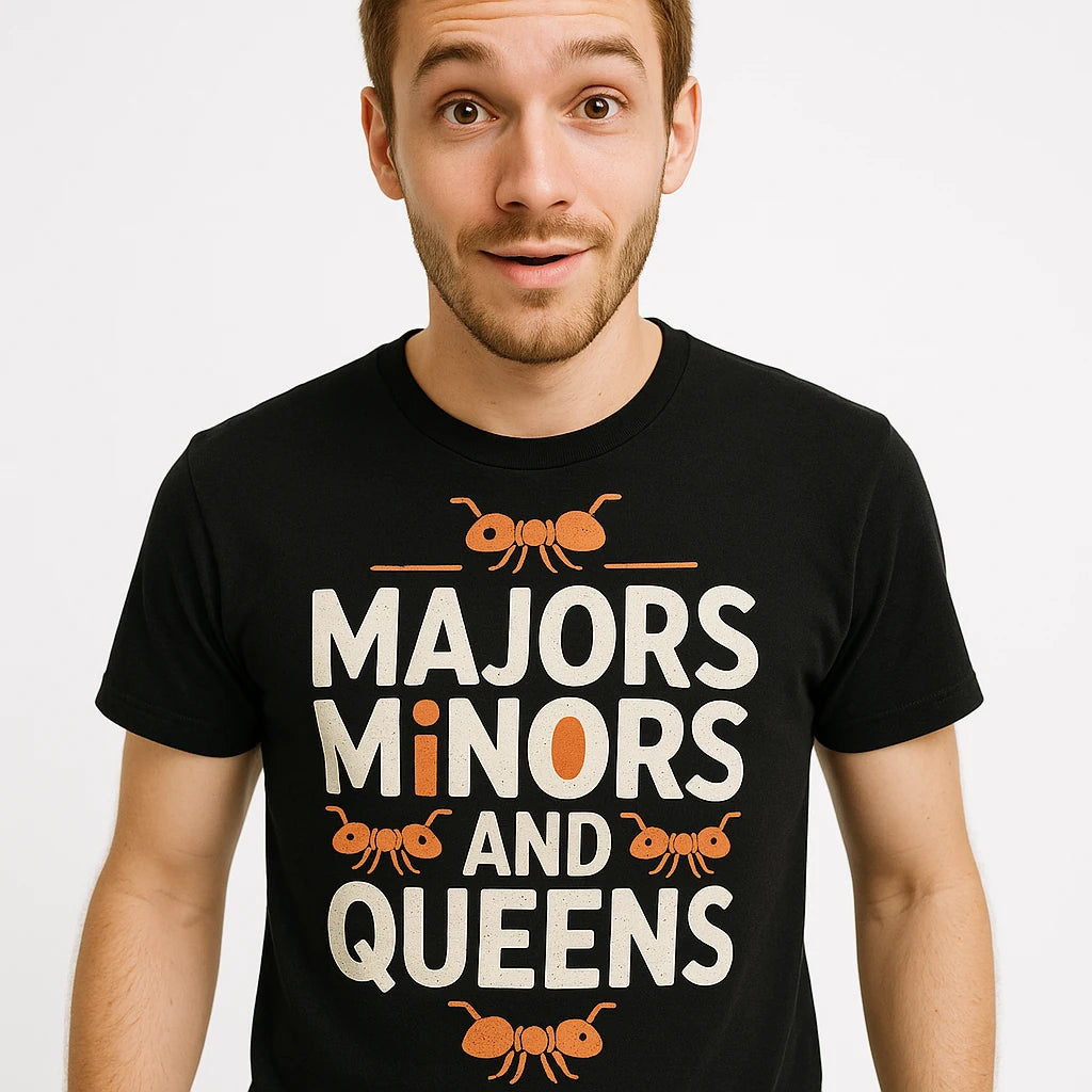 Close-up of the "Majors Minors and Queens" beige print on a premium Bella+Canvas black ant t shirt