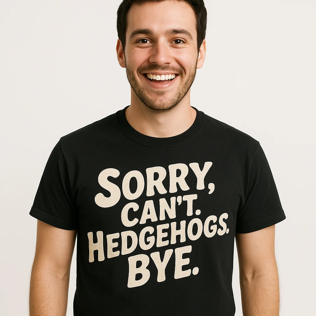 Close-up of the "Sorry. Cant. Hedgehogs. Bye." beige print on a premium Bella+Canvas black hedgehog t shirt