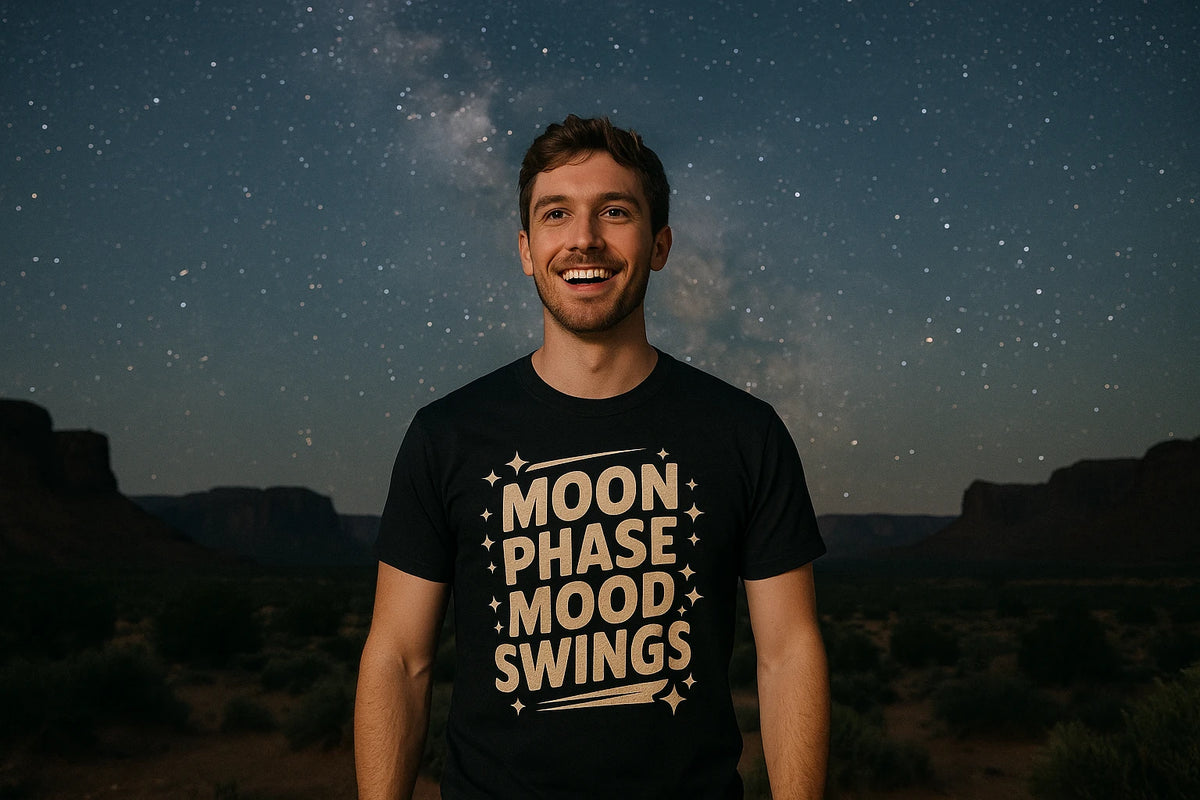 Lifestyle shot of the "Moon Phase Mood Swings" black stargazing t shirt in a real-world setting