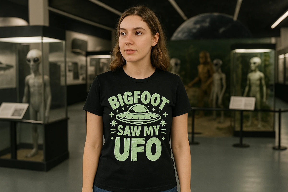 Lifestyle shot of the "Bigfoot Saw My UFO" black alien tee shirts in a real-world setting