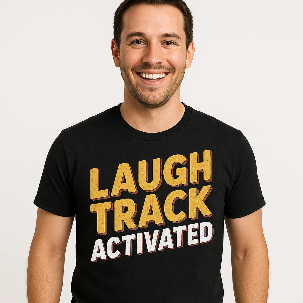 Close-up of the "Laugh Track Activated" gold print on a premium Bella+Canvas black daddy shirts