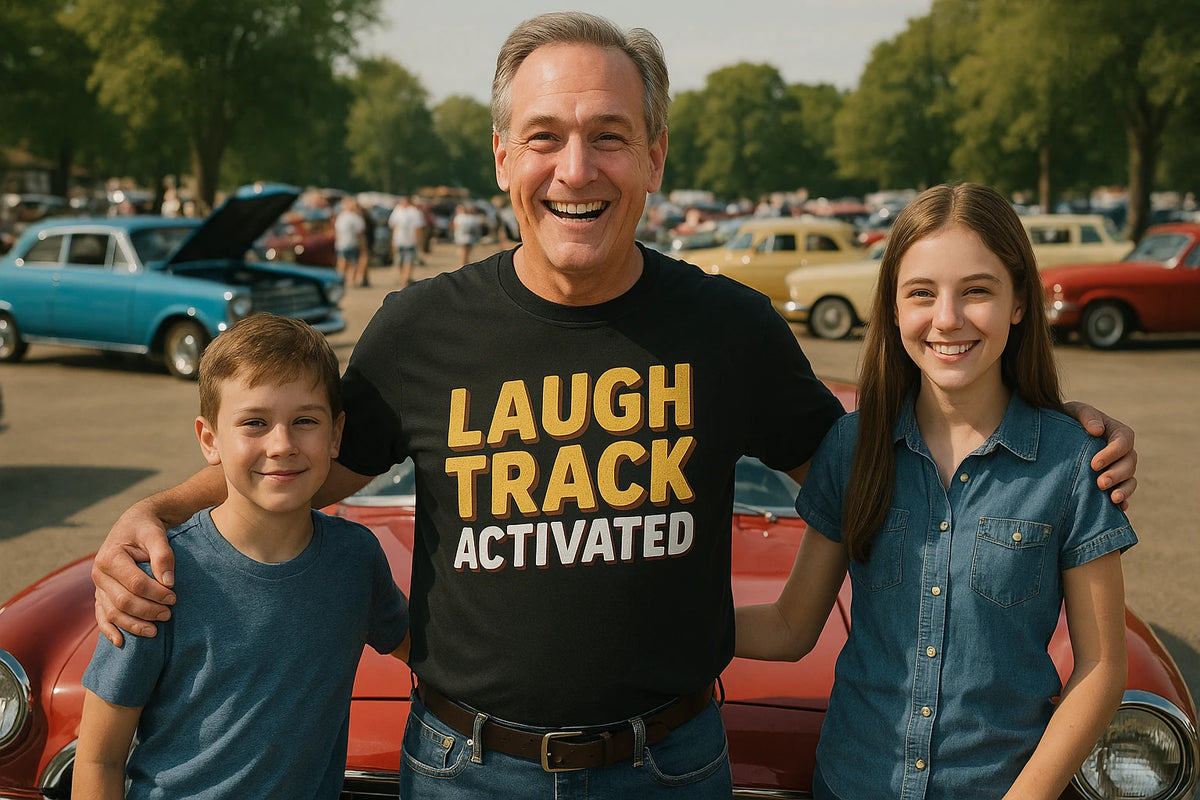Lifestyle shot of the "Laugh Track Activated" black daddy shirts in a real-world setting