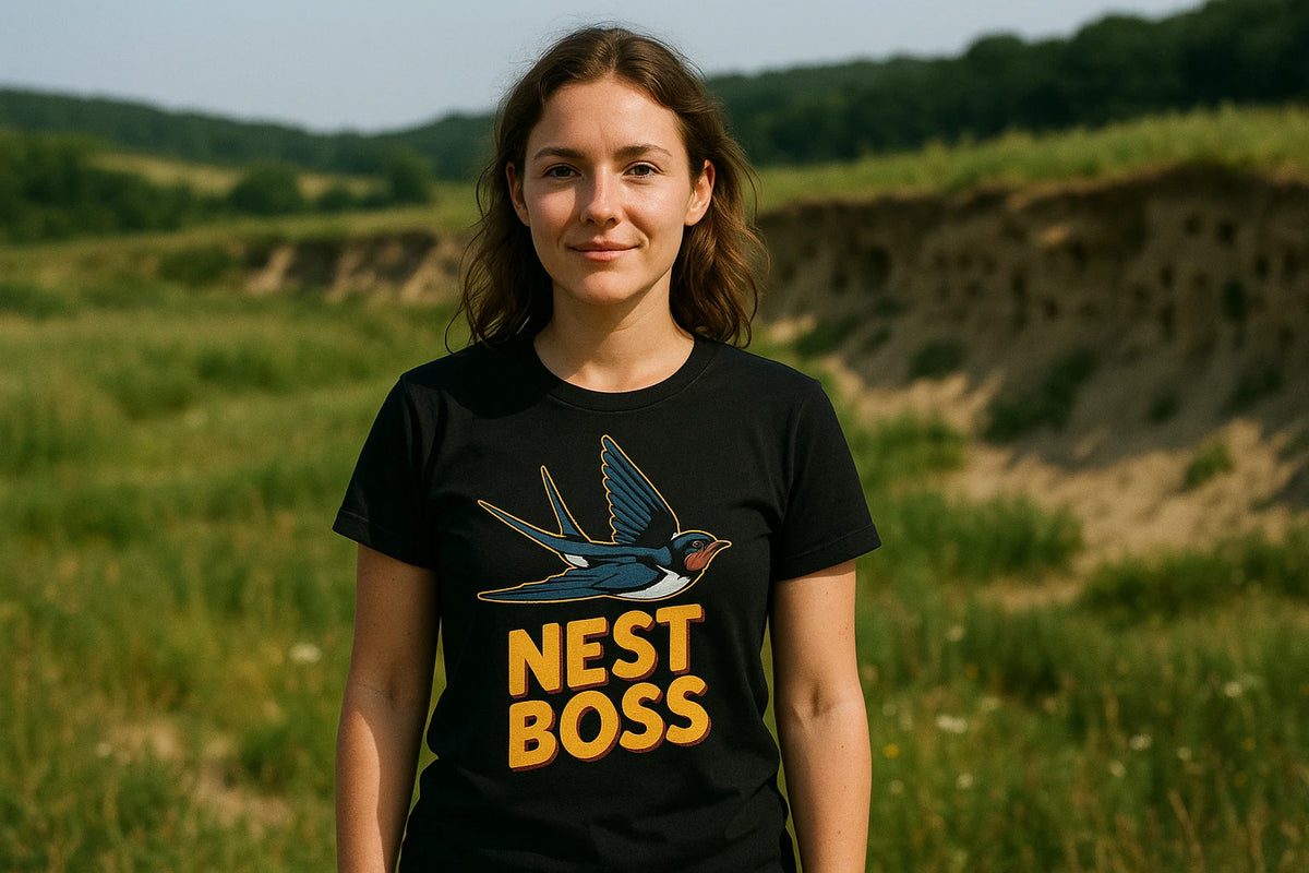 Lifestyle shot of the "Nest Boss" black swallow t shirt in a real-world setting