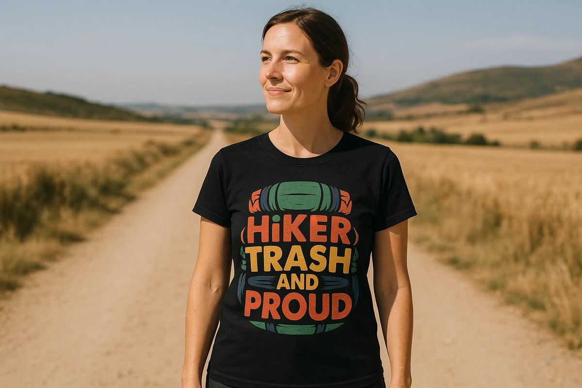 Lifestyle shot of the "Hiker Trash and Proud" black backpacking t shirt in a real-world setting