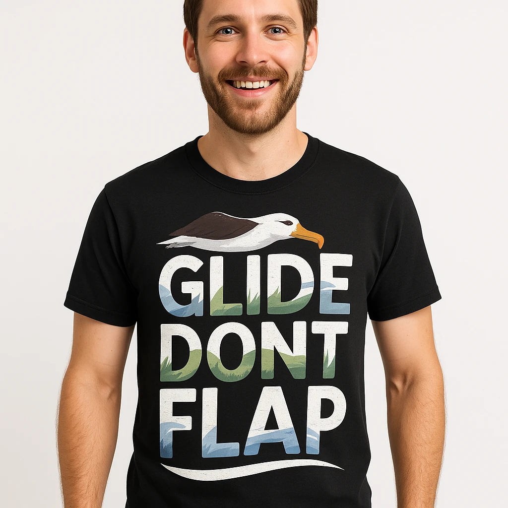 Close-up of the "Glide Dont Flap" white print on a premium Bella+Canvas black albatross t shirt