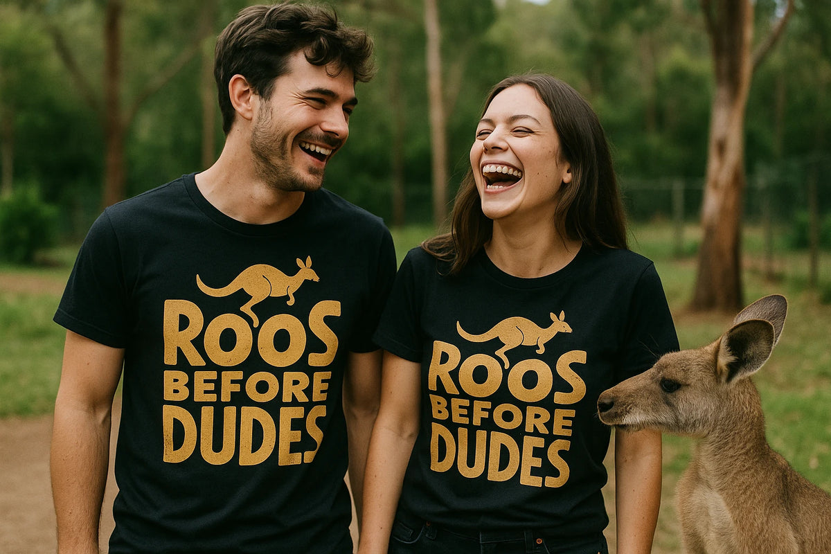 Person wearing the black kangaroo pocket t shirt graphic tee - "Roos Before Dudes" design