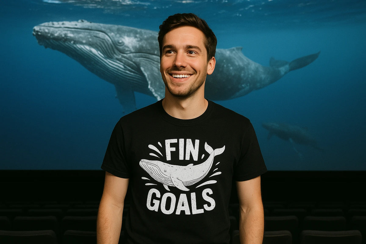 Lifestyle shot of the "Fin Goals" black killer whale t shirt in a real-world setting