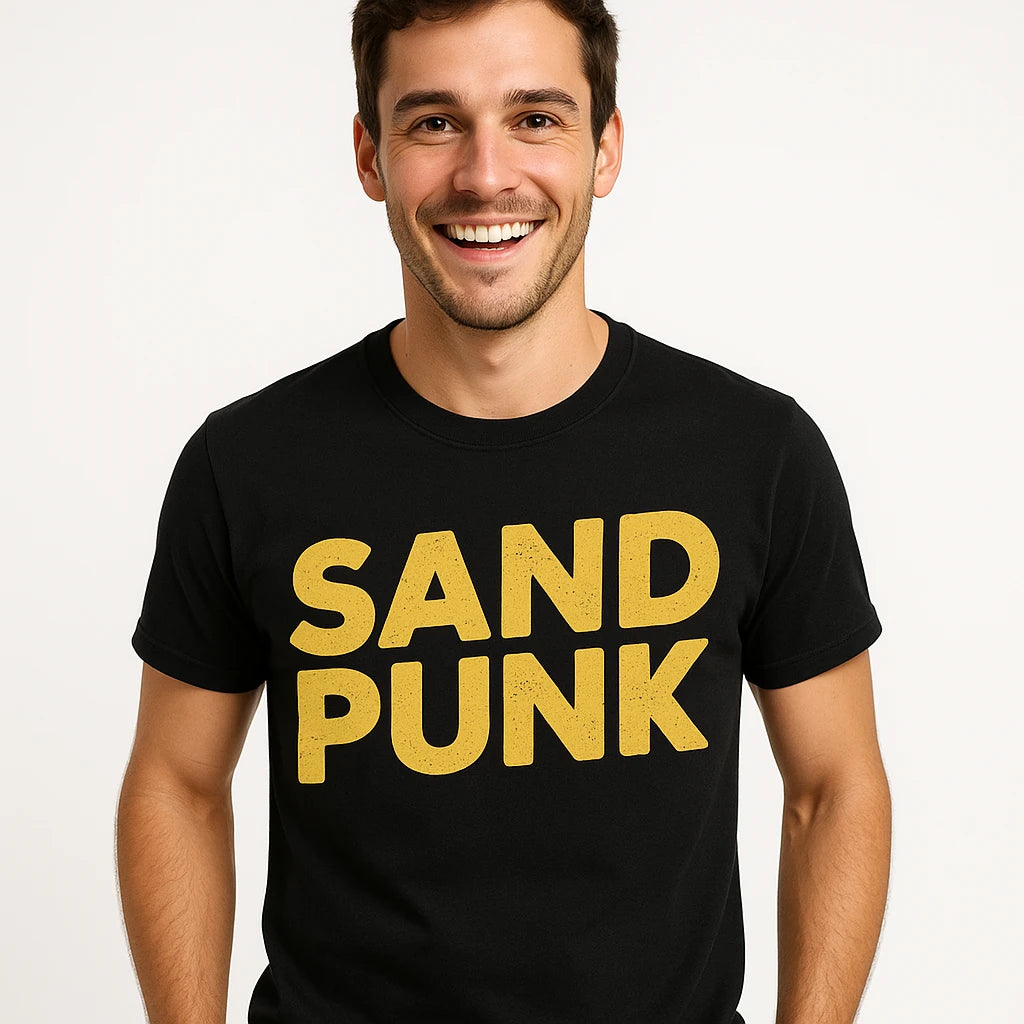 Close-up of the "Sand Punk" yellow print on a premium Bella+Canvas black sandboarding t shirt