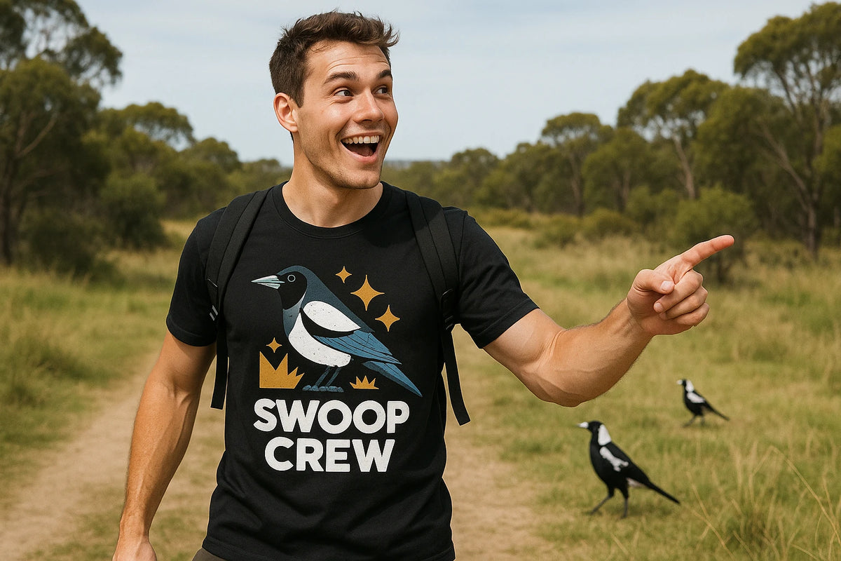Lifestyle shot of the "Swoop Crew" black magpie t shirt in a real-world setting