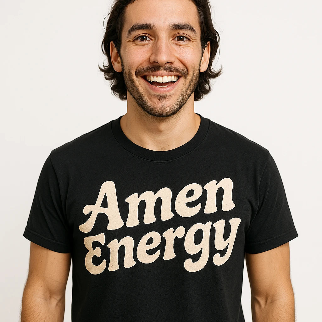 Close-up of the "Amen Energy" cream print on a premium Bella+Canvas black love and faith shirts