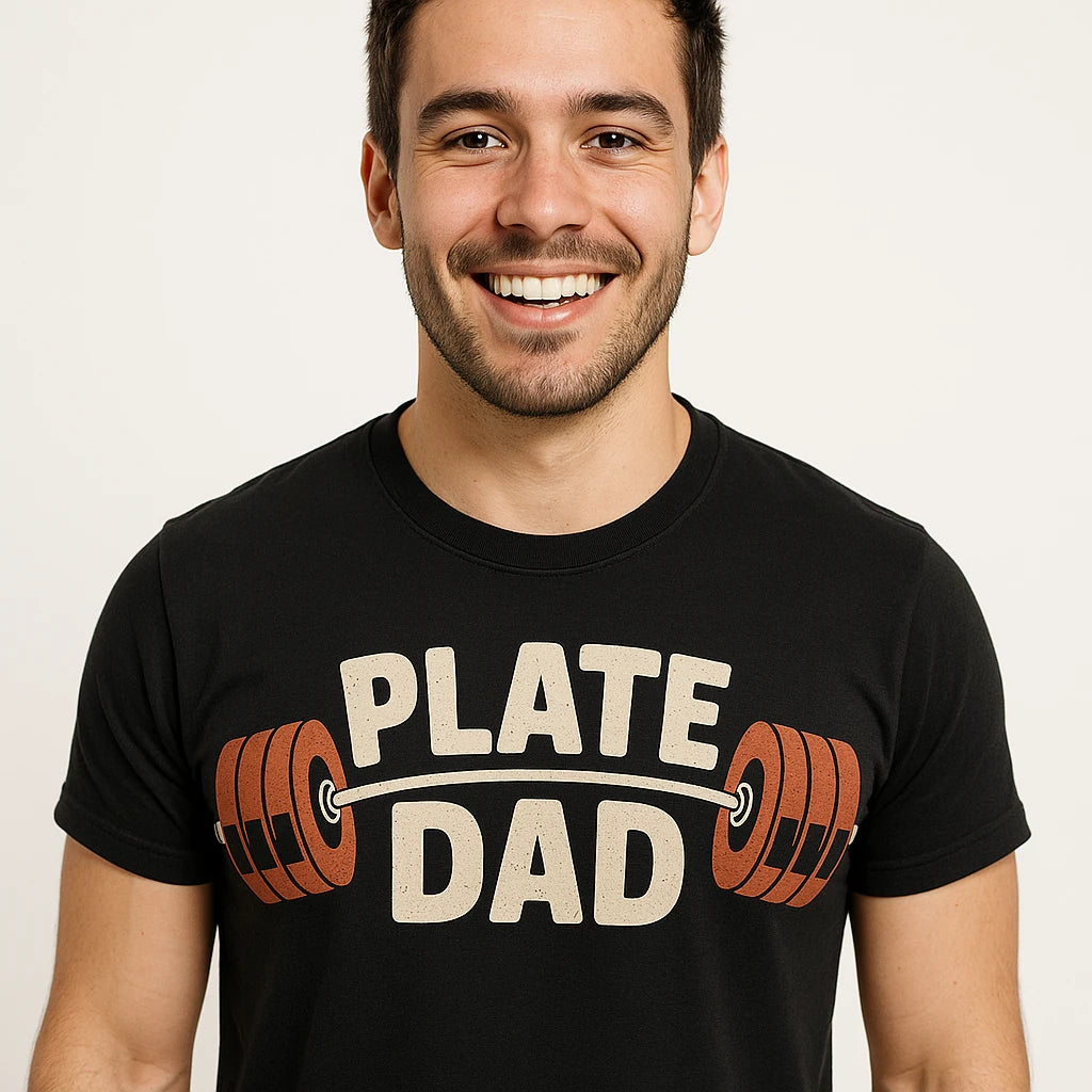 Close-up of the "Plate Dad" beige print on a premium Bella+Canvas black weightlifting tee shirts