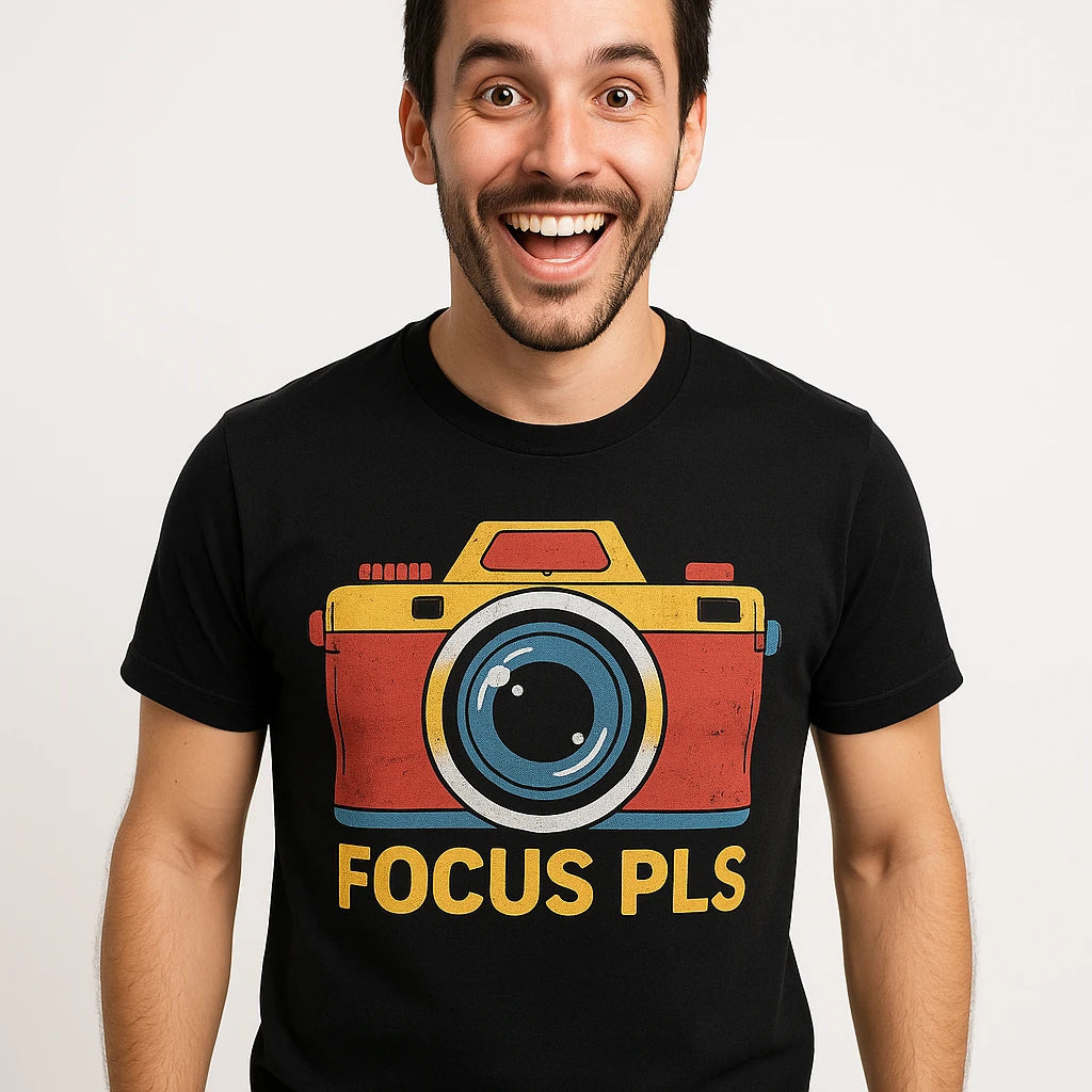 Close-up of the "Focus Pls" orange print on a premium Bella+Canvas black custom t shirts for photographers
