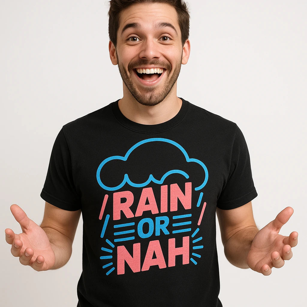 Close-up of the "Rain Or Nah" pink print on a premium Bella+Canvas black rain bow t shirt