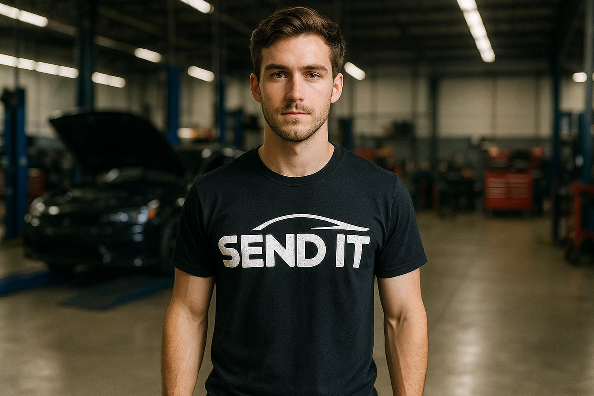 Lifestyle shot of the "Send It" black car t shirt in a real-world setting