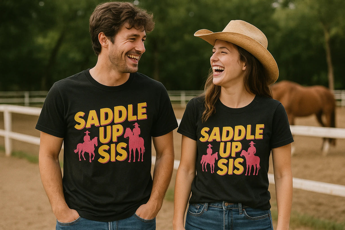 Person wearing the black shirts for horseback riding graphic tee - "Saddle Up Sis" design