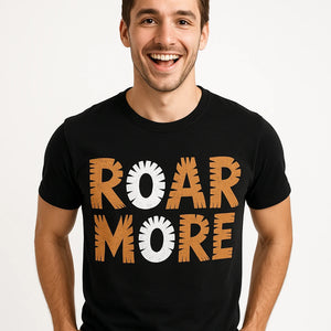 Close-up of the "Roar More" orange print on a premium Bella+Canvas black tiger tee shirt