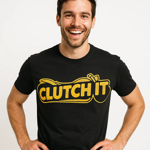 Close-up of the "Clutch It" yellow print on a premium Bella+Canvas black motorcycle shirts