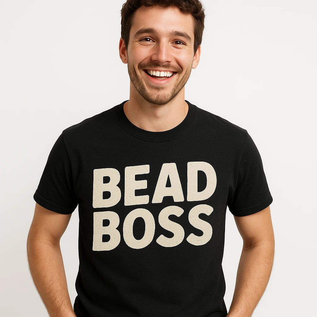 Close-up of the "Bead Boss" beige print on a premium Bella+Canvas black jewelry making t shirt