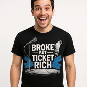 Close-up of the "Broke But Ticket Rich" white print on a premium Bella+Canvas black vintage concert t shirts